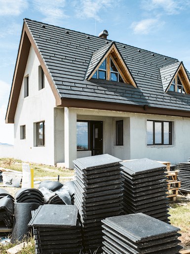 Screen Shot 2023-11-18 at 111121 PM Completed residential roofing project with black asphalt tiles, showcasing high-quality roof installation services with 28k successful roofing projects and zero failures